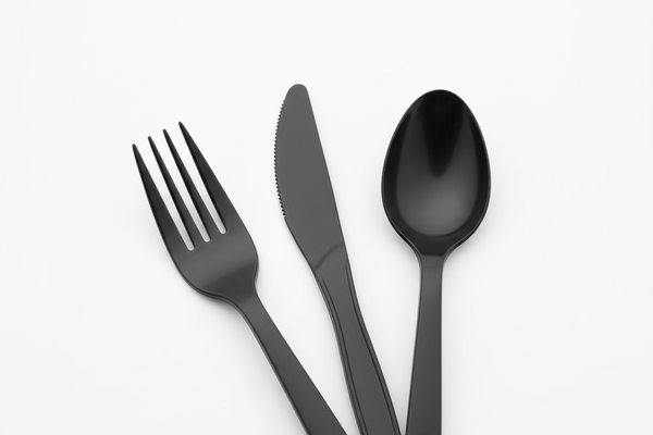 Heavy Duty Black Plastic Cutlery plain for takeaway in studio background